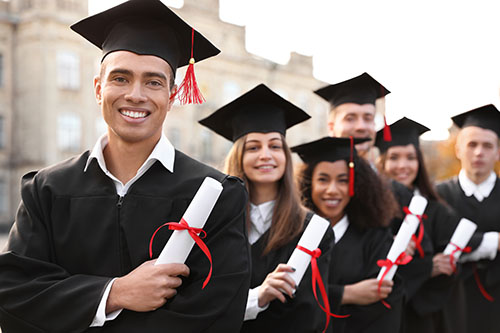 Happy,Students,With,Diplomas,Outdoors.,Graduation,Ceremony